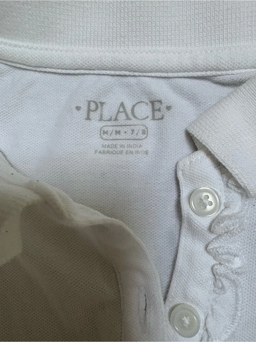 The Children's Place White Girls Polo with ruffle trim. Size M (7-8)